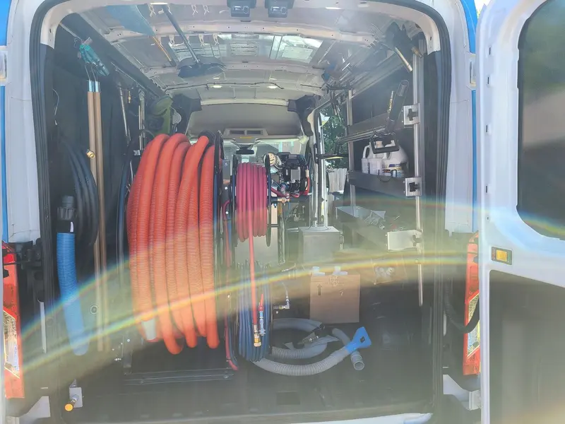 Rear of the HydroClean van with hose reels and cleaning tools