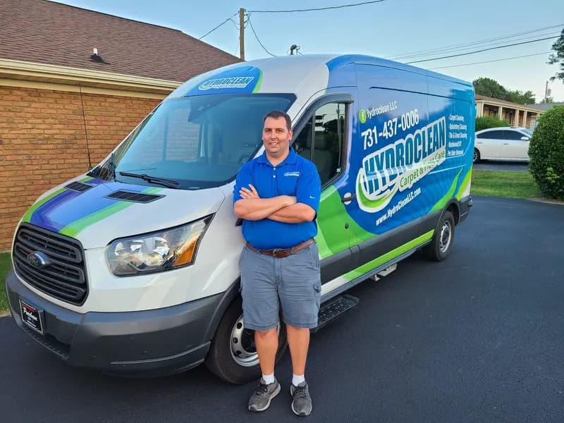 David Laton in front of the HydroClean van, seen from the front