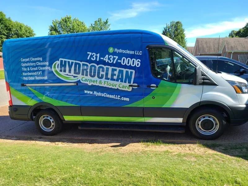HydroClean Carpet & Floor Care van with the company logo and phone number