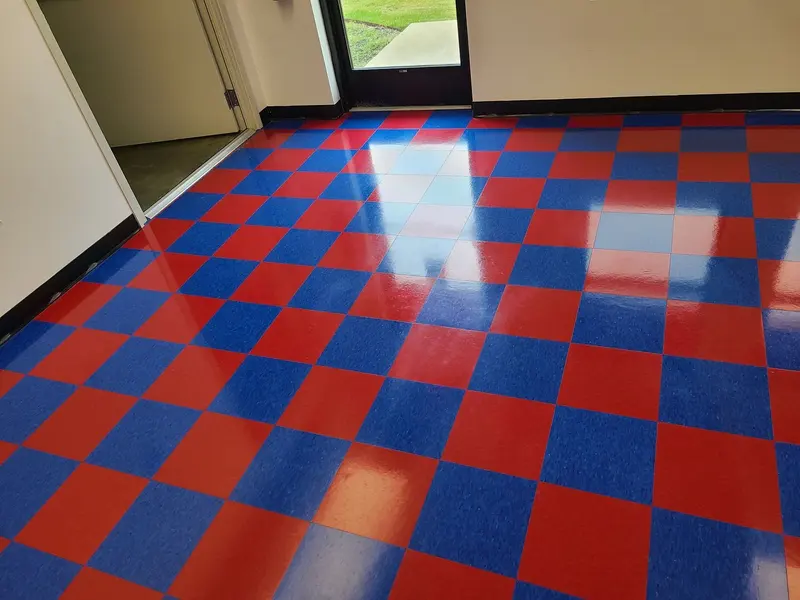 Red and blue checkered VCT floor with a fresh, glossy coat of finish