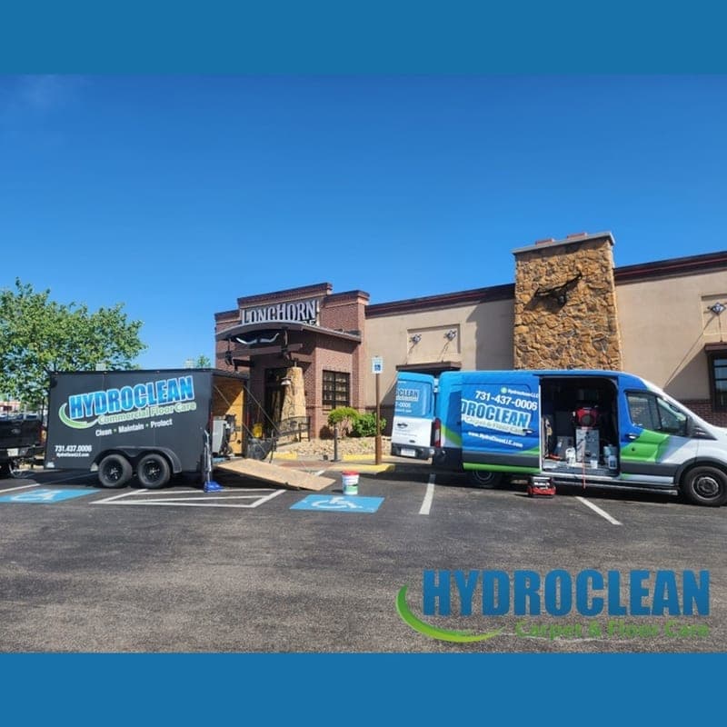 HydroClean van and trailer parked outside a restaurant