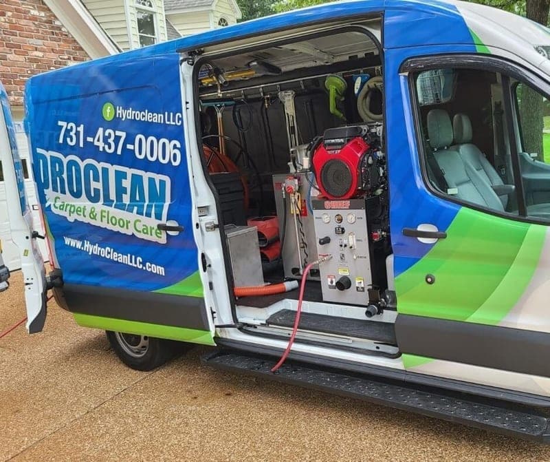 HydroClean van with the side door open, showing the truck-mounted cleaning unit