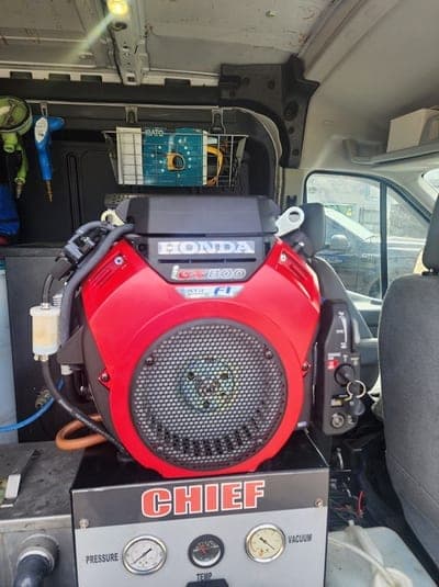 Close view of the truck-mounted cleaning unit inside the HydroClean van